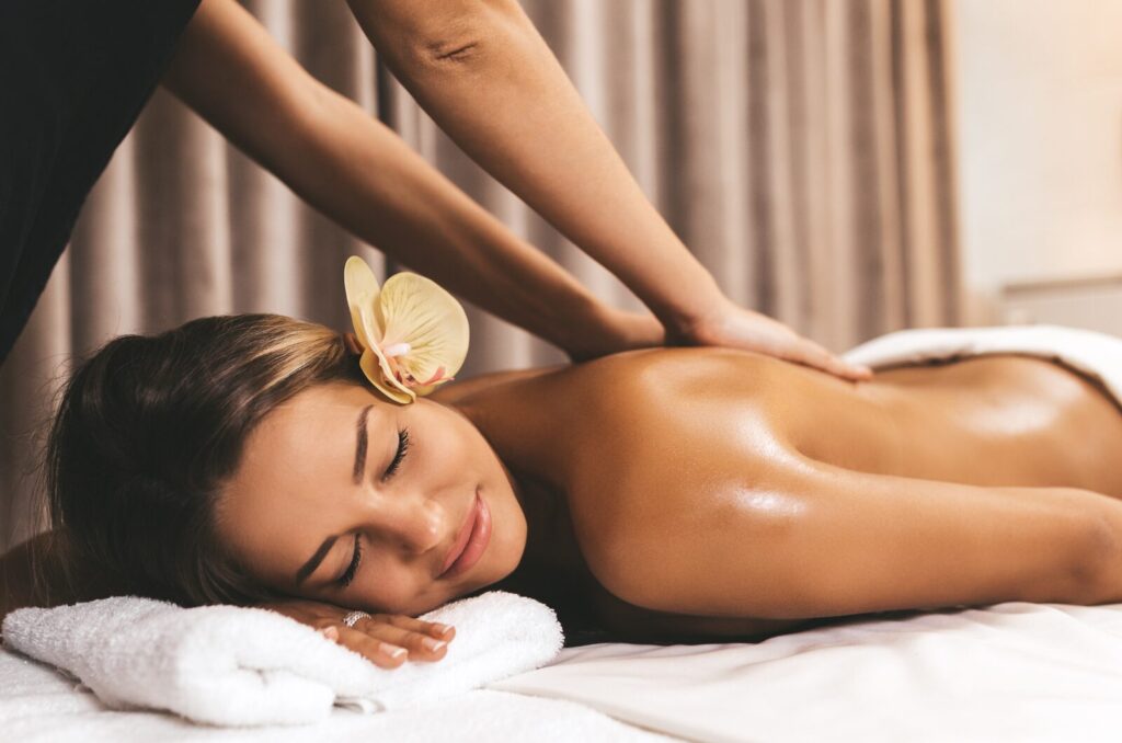 Woman receiving lymphatic drainage body massage to reduce swelling, support detoxification, and enhance wellness