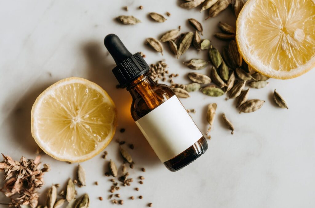 Essential oil synergy blend bottle with lemon and herbs, symbolizing natural aromatherapy for balance and wellness